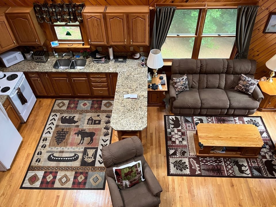 View of the kitchen and living room from the second floor balcony. 