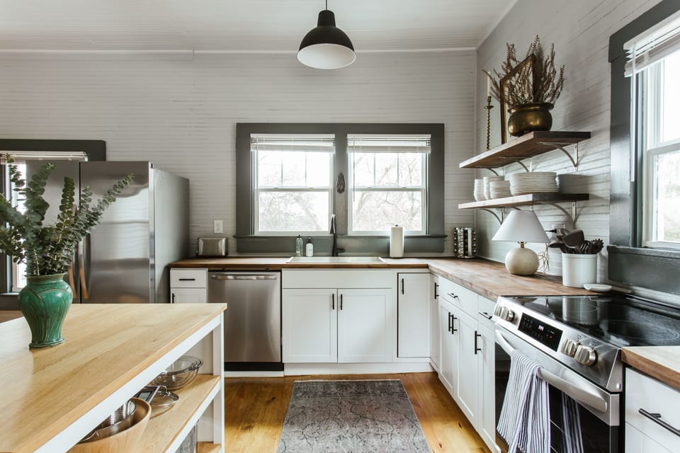  With stainless steal appliances, a full spice rack, and all your bakeware needs available, you’ll be able to make yourself right at home as you cook. The kitchen also contains a large dining  table for family dinner and a fully stocked coffee bar. 