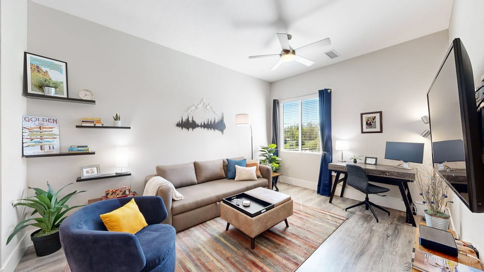 Stylish Living Room | Queen Sleeper | 55" Articulating Smart TV | Desk & Monitor