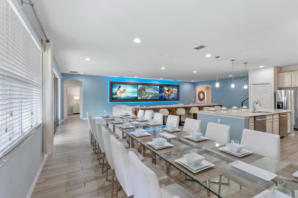 - Bright dining setup with seating ready for the full group  
- Modern open plan design flows into kitchen and lounge  
- Comfortable space for family dinners parties and stays