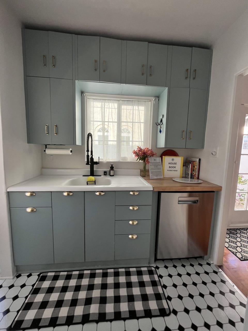 Original cast iron sink and metal cabinets.