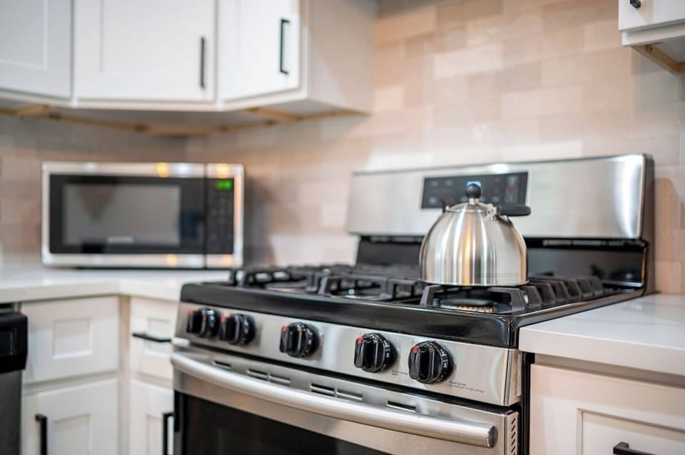 Stainless steel appliances, including refrigerator with ice maker.