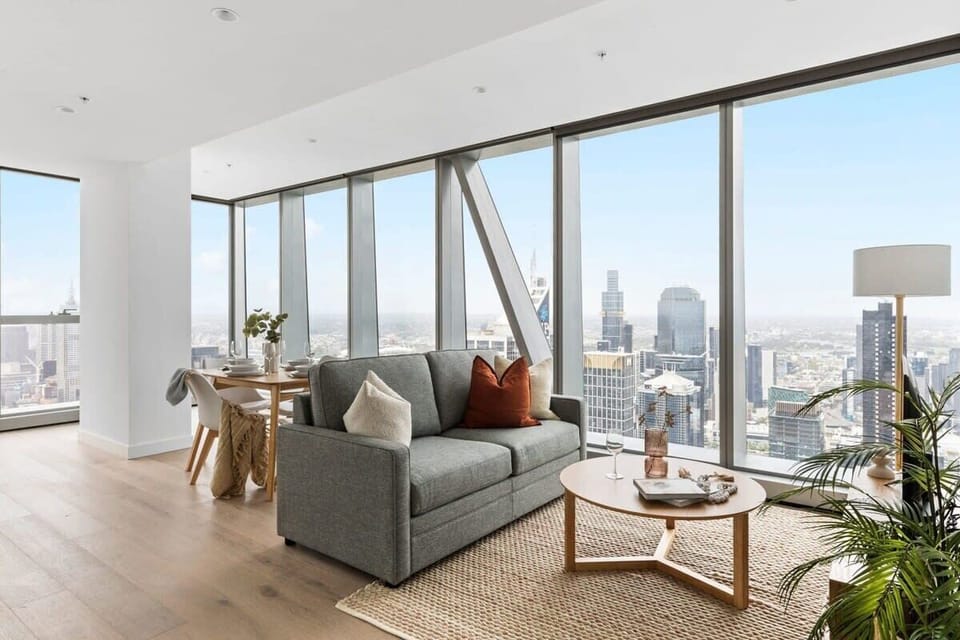 A spacious living area with a 3-seater sofa bed.