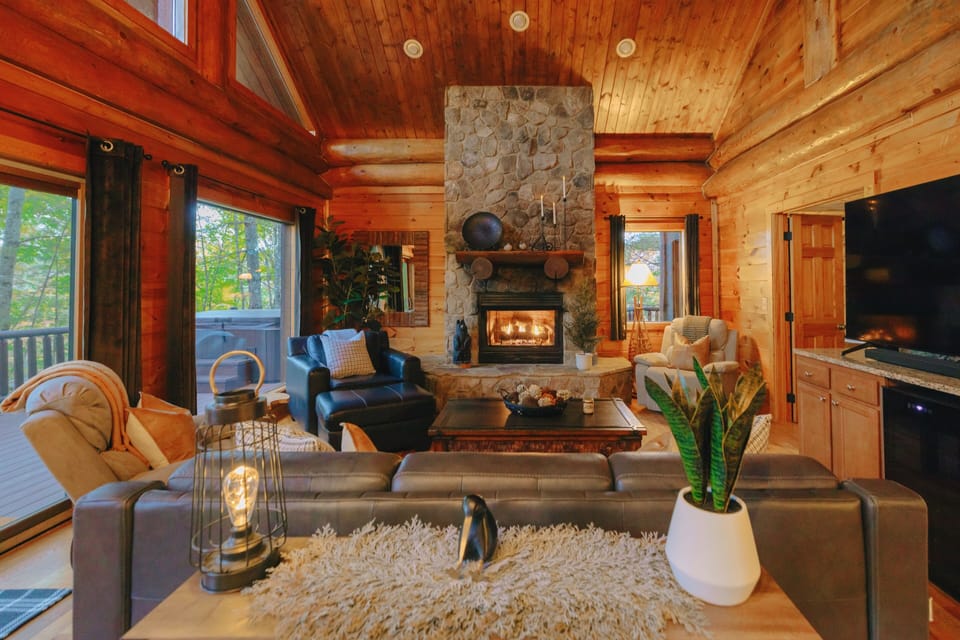 Kick back and unwind in our living room with a large TV, perfect for movie nights and entertainment, offering a cozy retreat after a day of adventures.