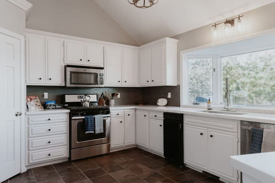 Stone counters, stainless appliances, and more views of the lake. The kitchen has everything you'll need for your getaway