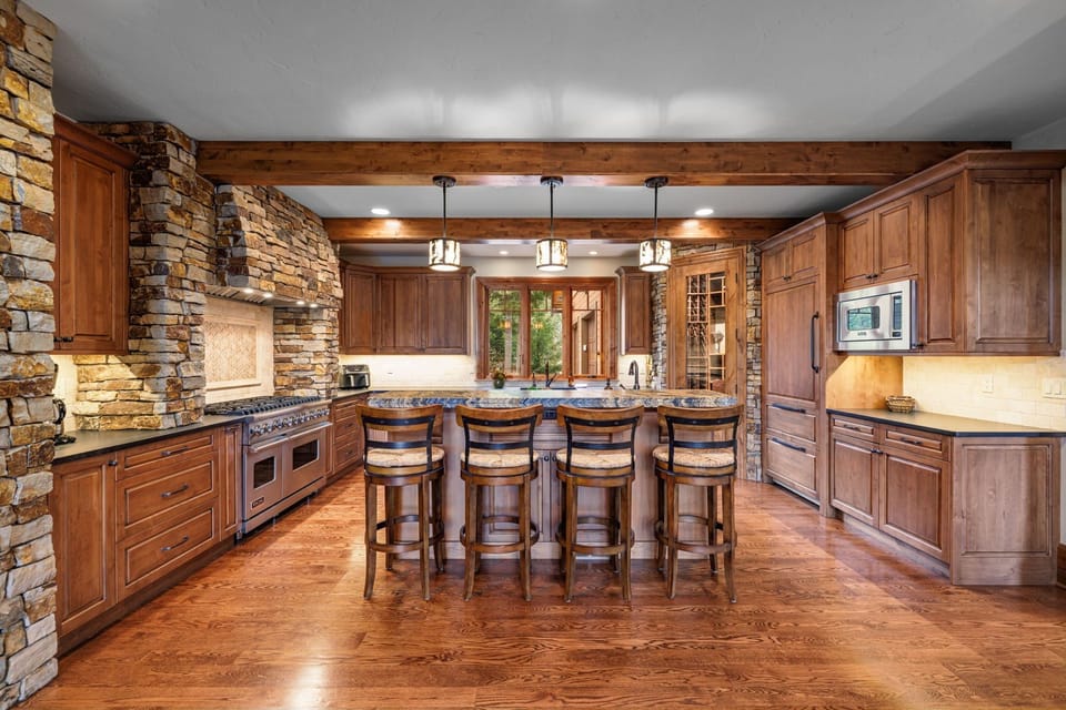 The spacious island offers ample seating, making it a perfect gathering spot for family and friends