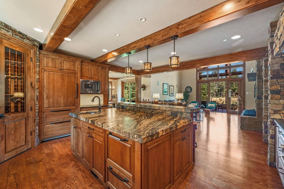 Indulge in culinary delights in this high-end mountain kitchen, complete with a built in wine cellar