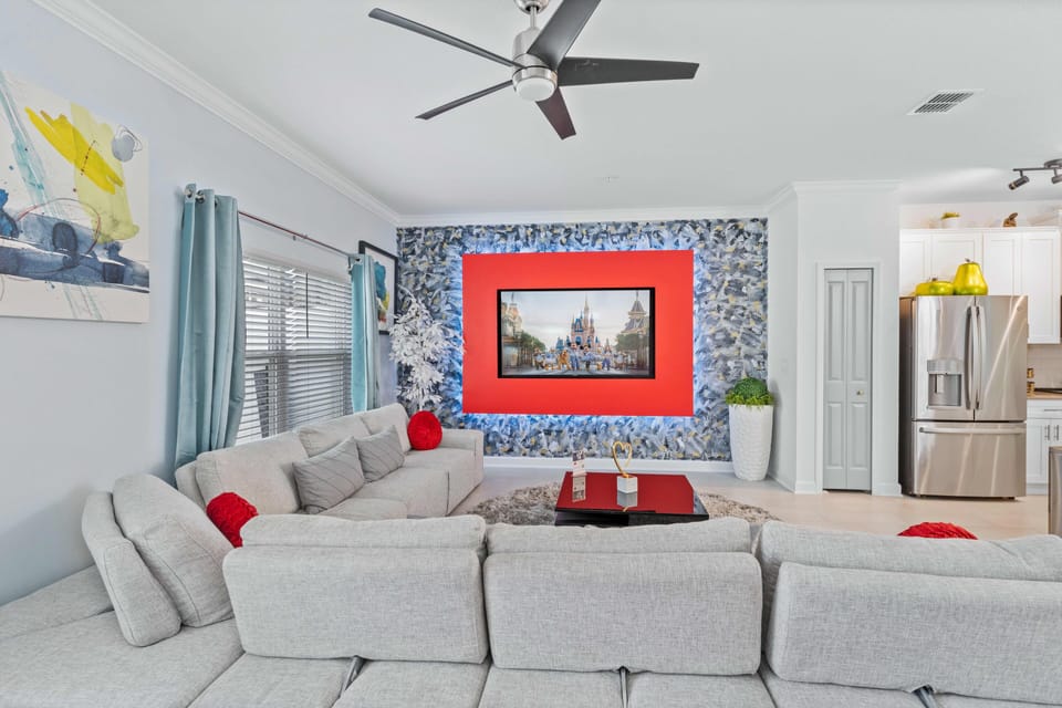 Relax in our spacious living area, featuring a large sofa that comfortably seats all guests for enjoyable TV entertainment.