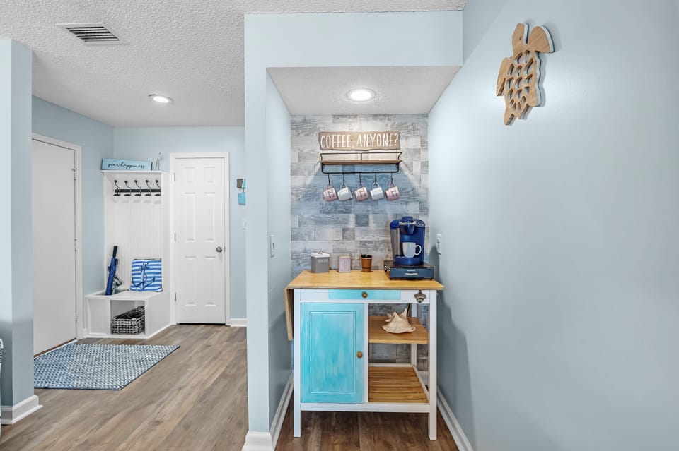 Brew, relax & enjoy peaceful lagoon views from your private Gulf Shores balcony.