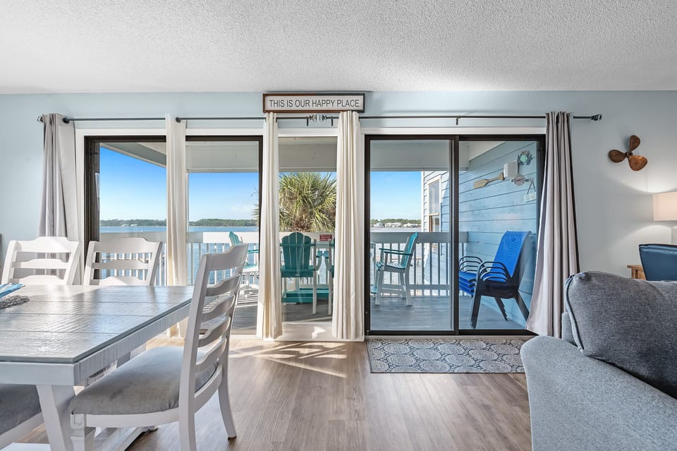 Open Living & Dining Space Framing Breathtaking Lagoon Views