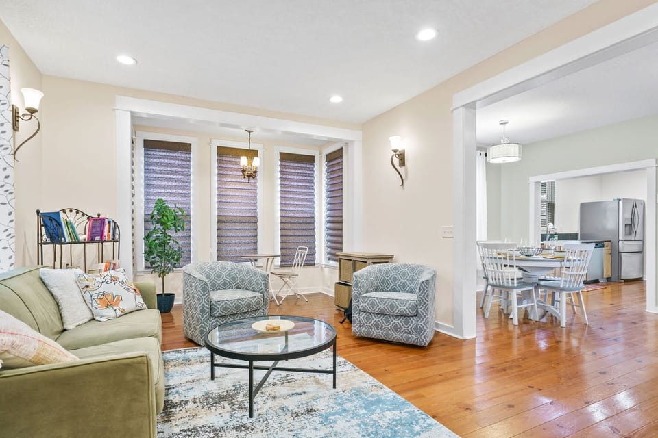 Living room leads into Dining area with Kitchen to the far right.