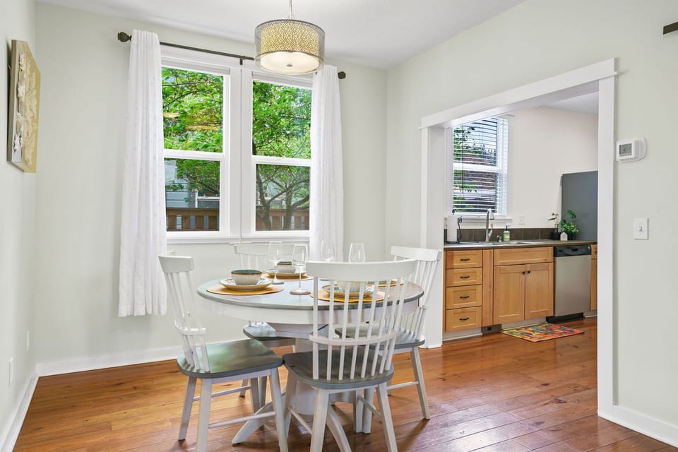 Dining area is between Living room and Kitchen.  Light filled and comfortable.