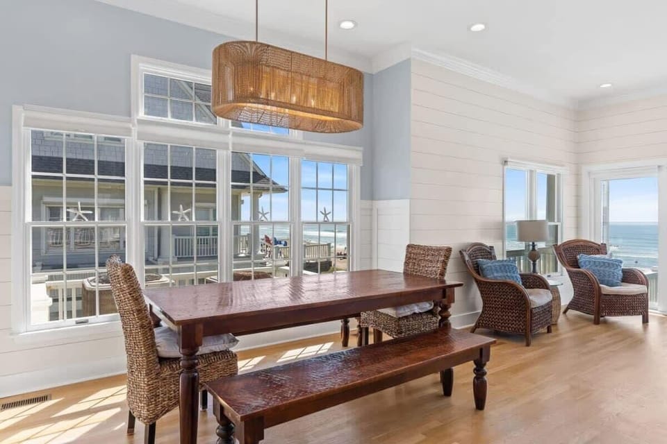 The dining table features benches for a close-knit dining experience.