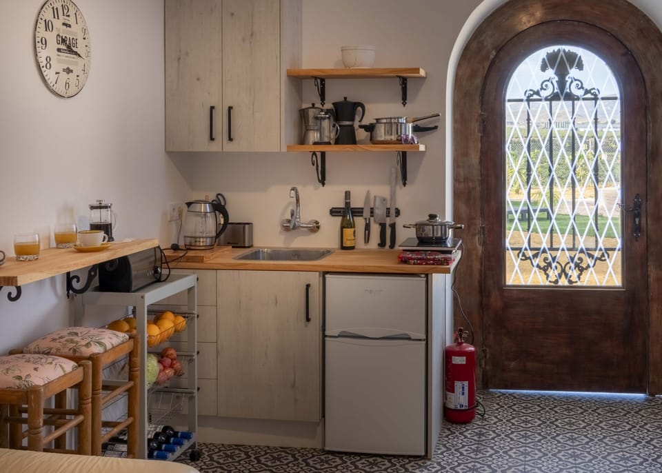 Villa kitchen with kettle, toaster, 2 ring hob and fridge. See outdoor kitchen 