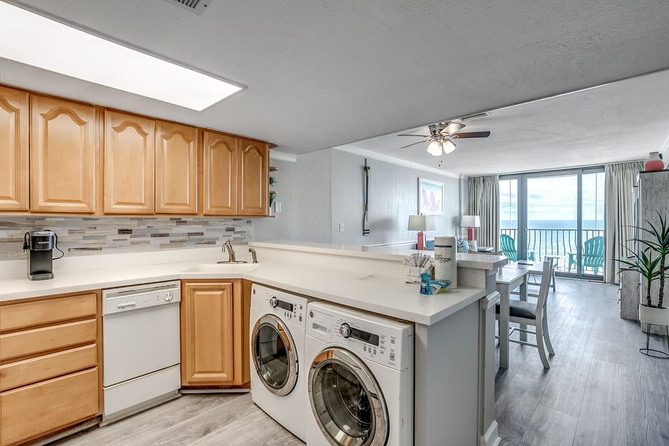 Kitchen with washer and dryer