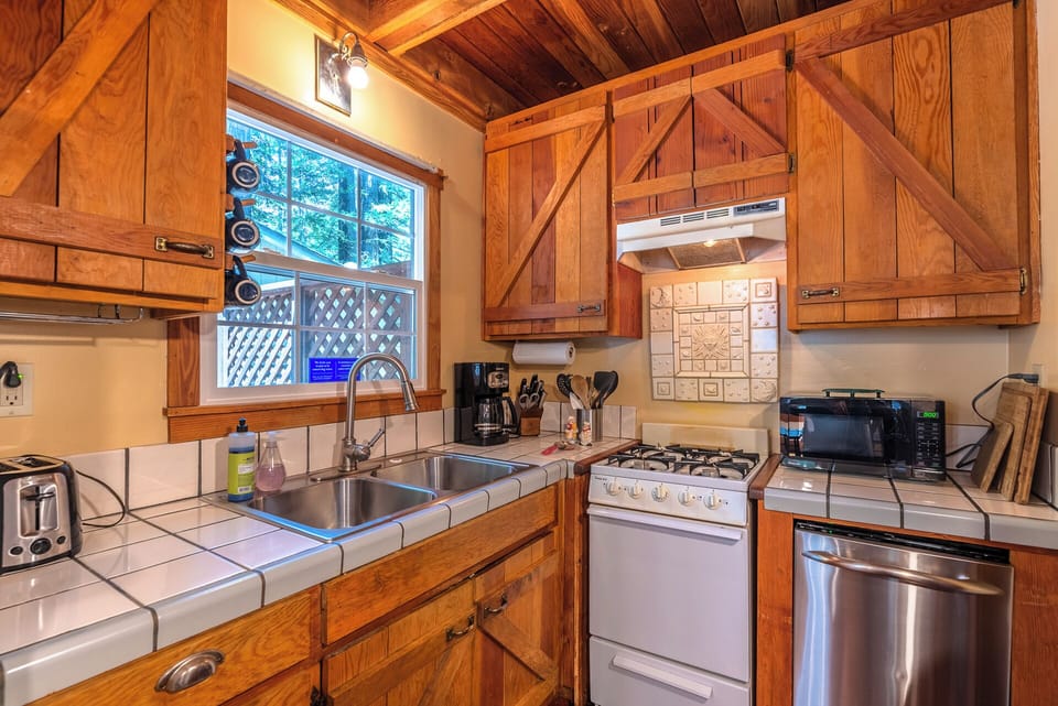 The kitchen is small but cozy with everything - you need for great meals.