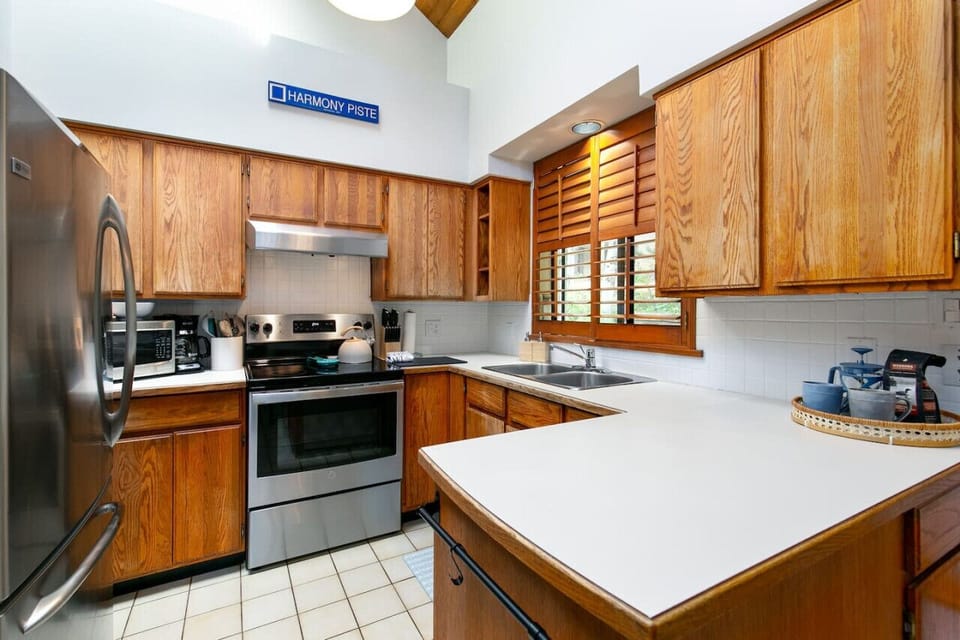Large Fridge, Lots of appliances including: microwave, oven, stove, kettle, coffee maker more.