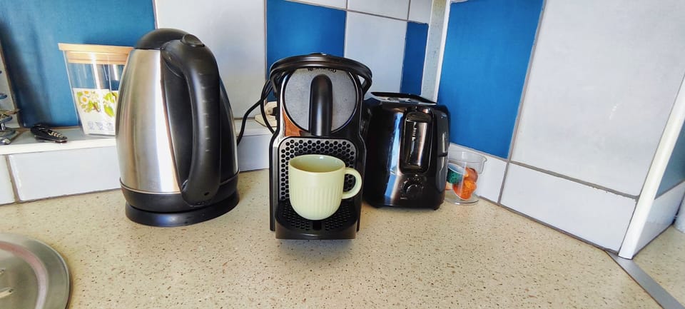 Nespresso coffee maker, with toaster and kettle.