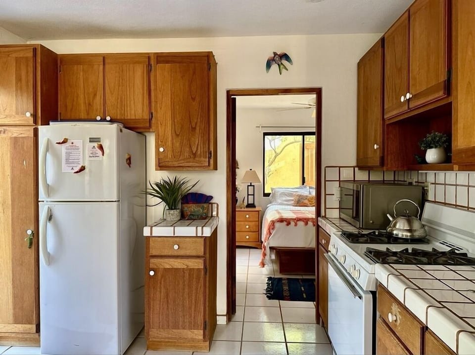 Indoors, Kitchen, Refrigerator, Bed, Furniture