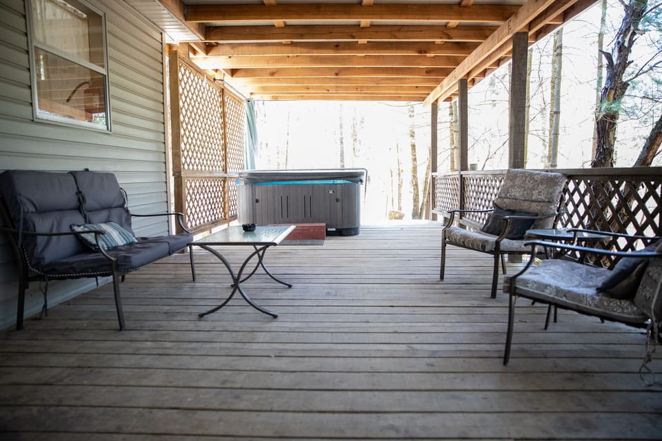 Covered porch with hot tub