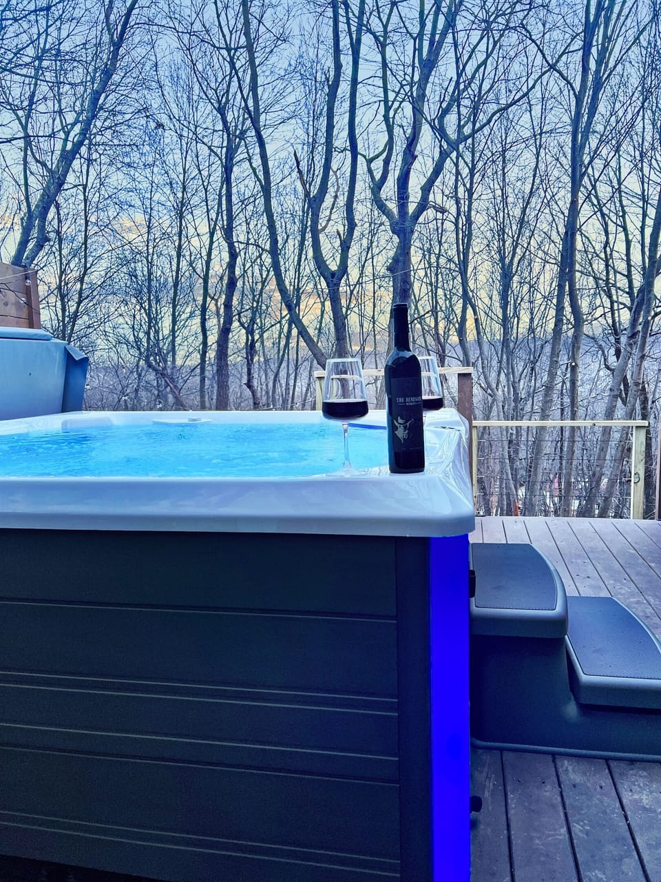 Sippin' and soakin' – where relaxation meets sophistication. #HotTubChill #WineTime