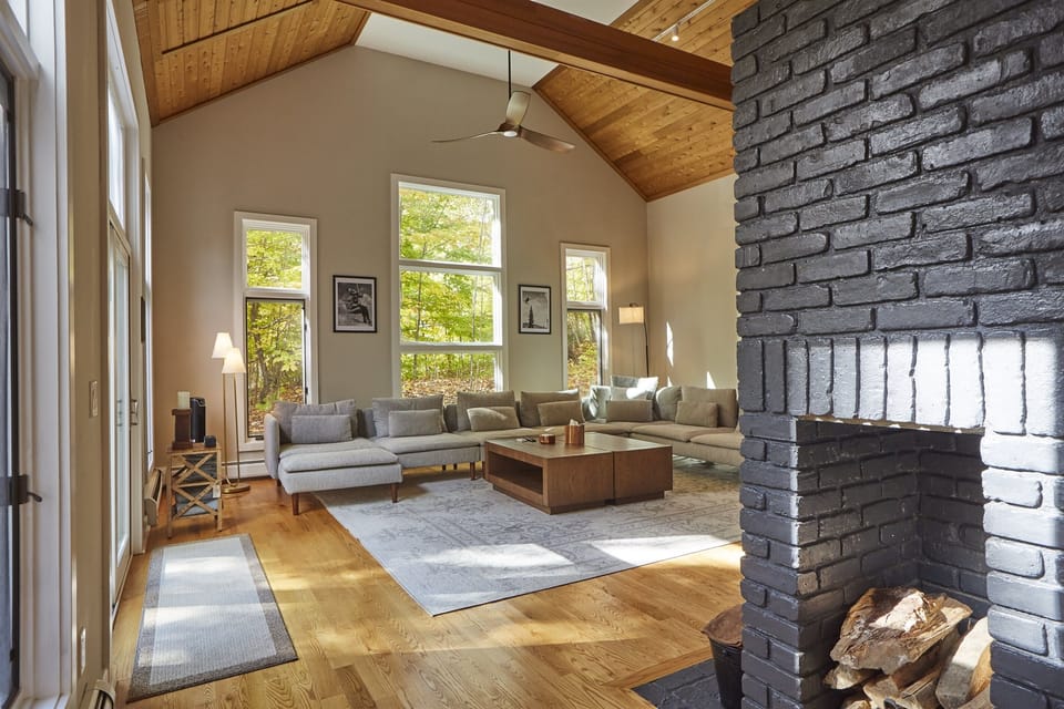 Relax in this stunning Vermont retreat, where modern comfort meets natural beauty. Bask in the light-filled living room with vaulted wood ceilings, surrounded by serene forest views. Perfect for a cozy getaway with two families or all of your friends!