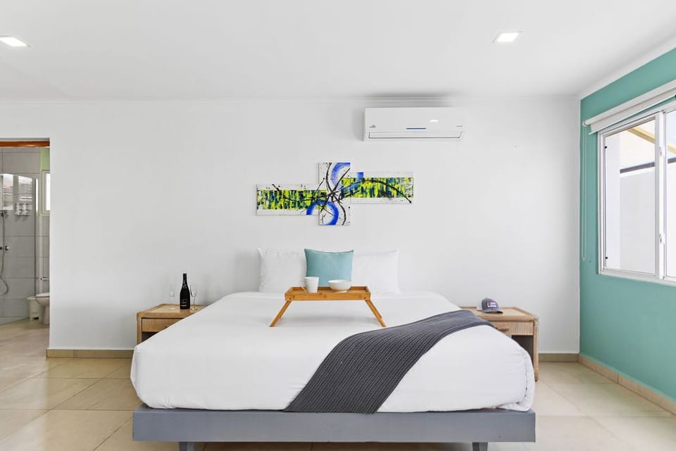 Discover a haven of comfort and convenience in our stylish studio, featuring a spacious king bed, TV, and refreshing AC.