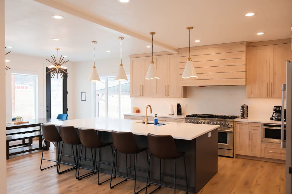 Perfect for family cook nights: fully stocked kitchen, ample seating, and counter space!