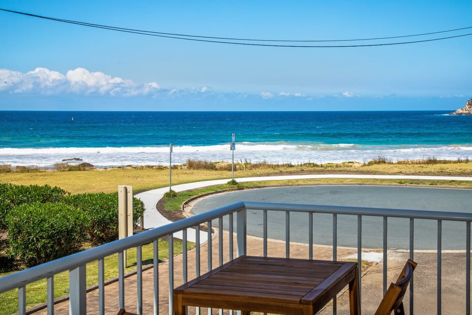 Enjoy the sea breeze and ocean sounds on the balcony after a day on the beach.