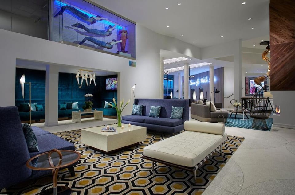 Unwind in the stylish lobby with cozy, modern seating.