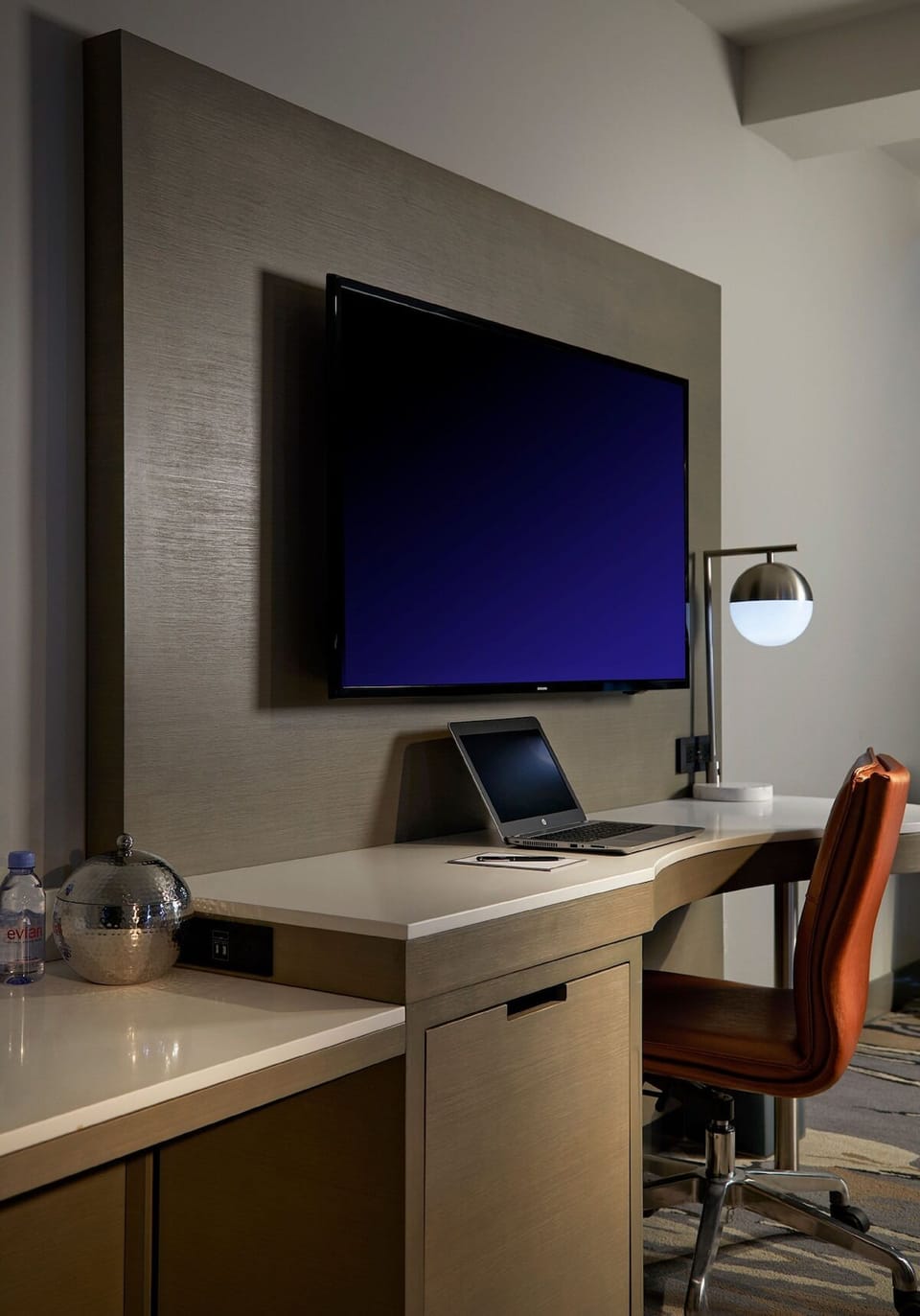 Catch up on emails at a sleek desk and HDTV.
