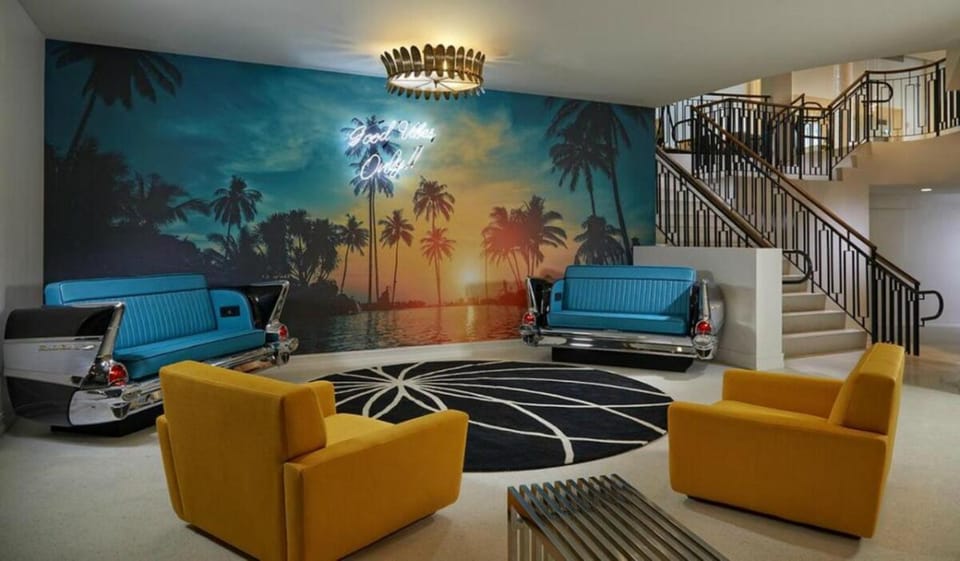 Gather and relax beneath bold art in a welcoming lounge.