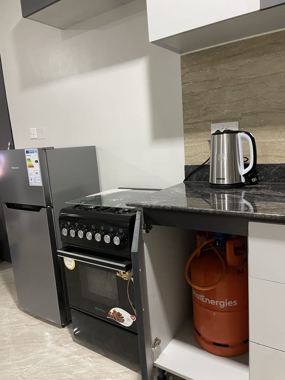 Fridge with freezer and gas cooker with oven