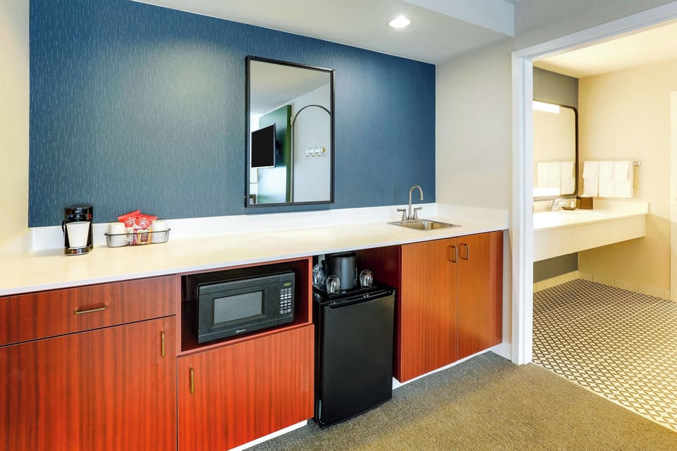 Fuel your day with the convenient kitchenette, sink, and mini-fridge.