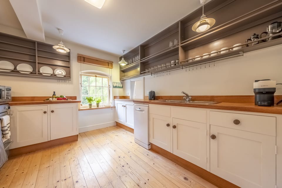 First floor: A country-style fitted kitchen view river views
