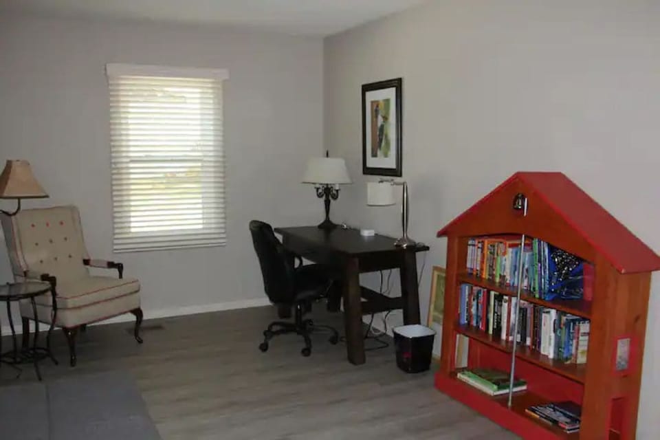 Study with desk, reading nook and bookshelf
