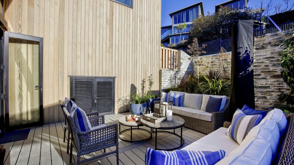 Sunny and sheltered courtyard with sun umbrella