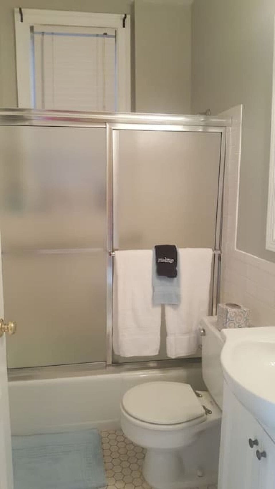 Bathroom with shower and bath tub.