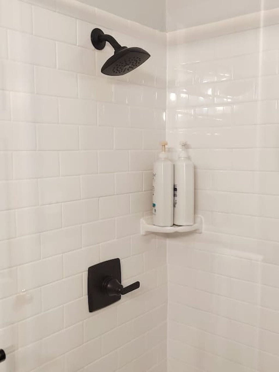 Shower with shampoo, conditioner and body wash provided.