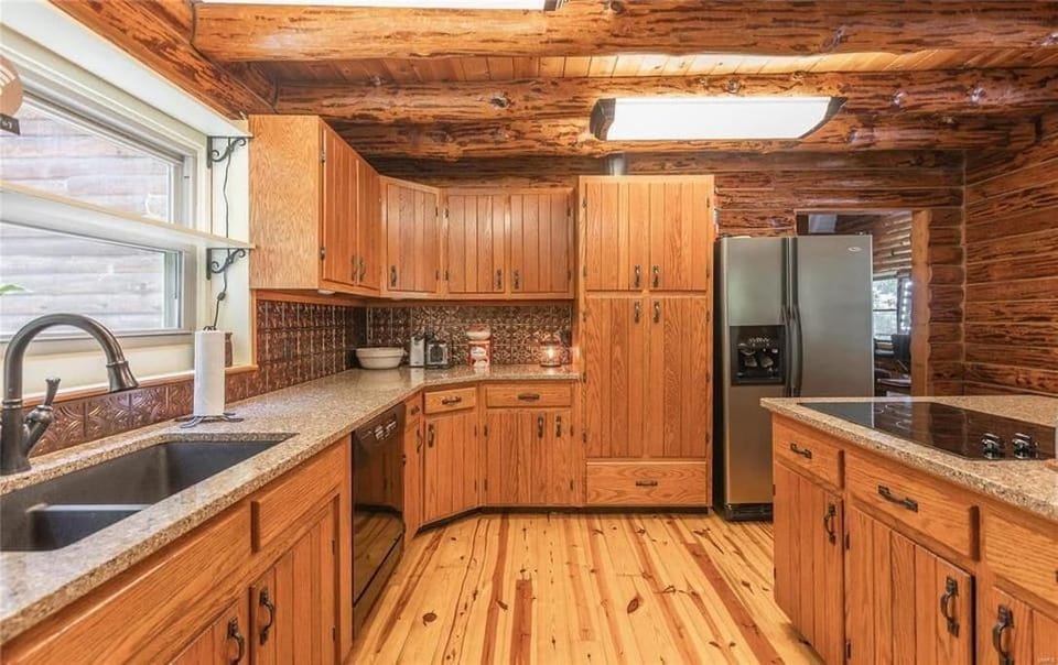 Full kitchen with modern appliances and cabinets 