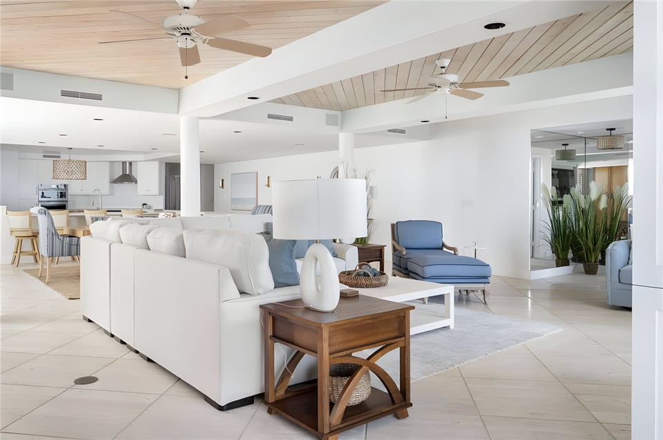 Large living room with smart TV and ocean views.  
