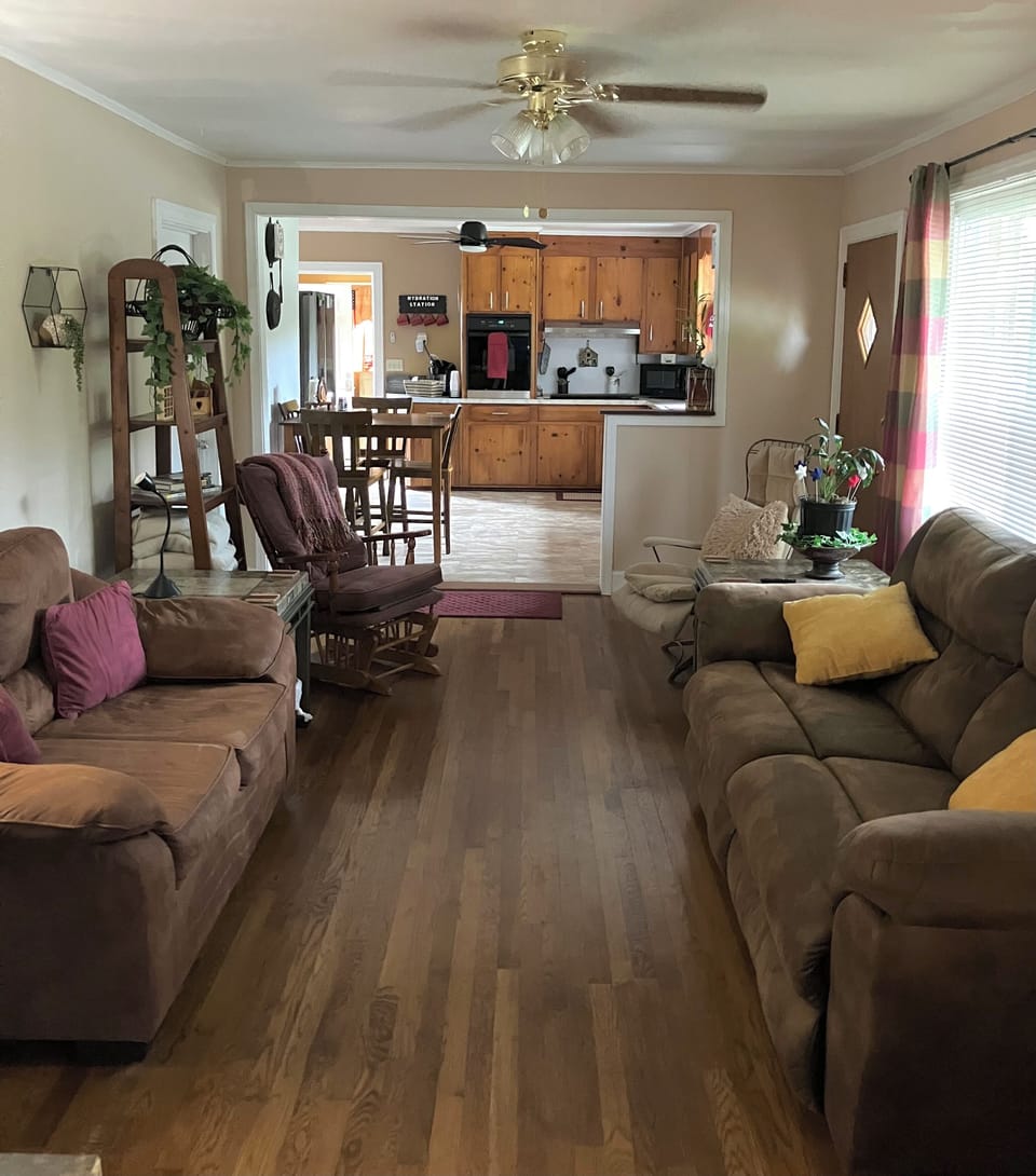 Cozy living room to sit, eat, relax and make memories, TV trays and smart TV.