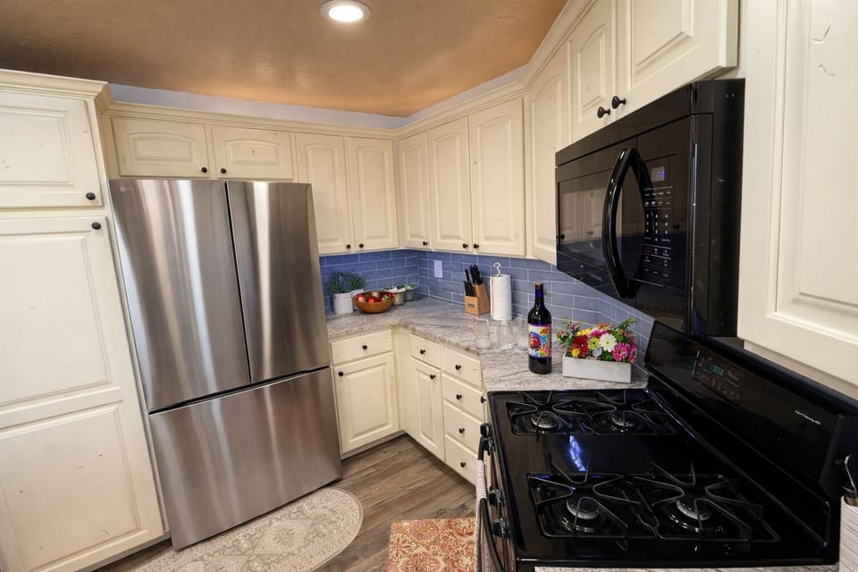 Prepare meals with ease in the fully equipped kitchen offering generous storage and updated appliances.