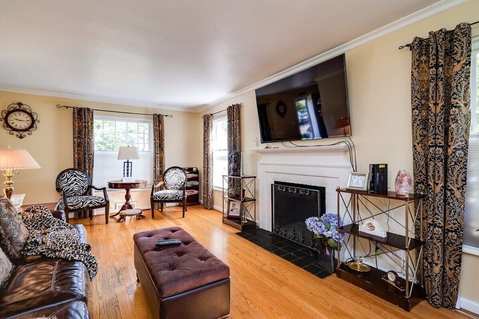 Cozy up by the gas fireplace in our historic Colonial living room.