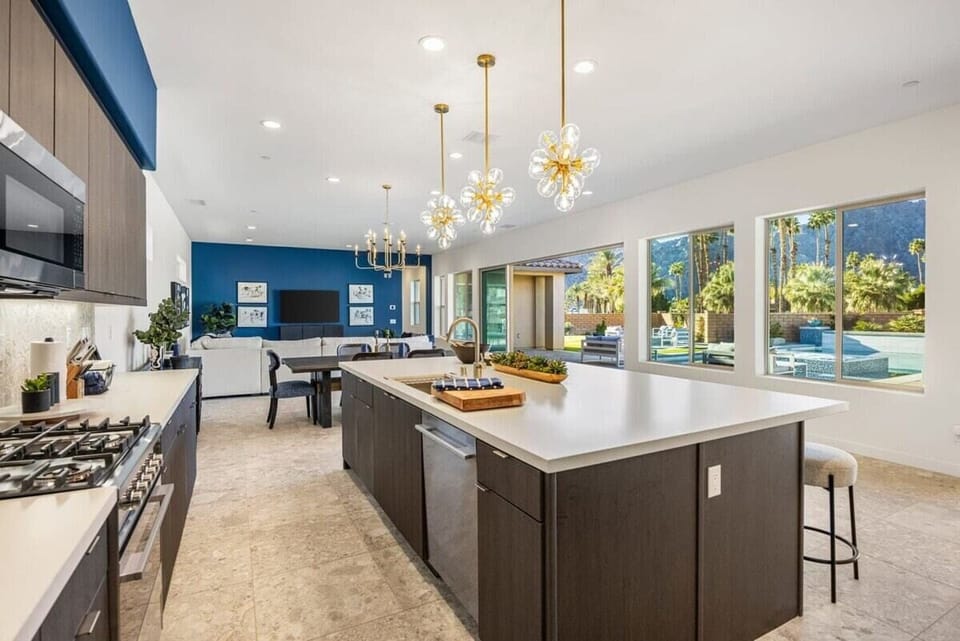 Bright and spacious kitchen with a view of the pool.