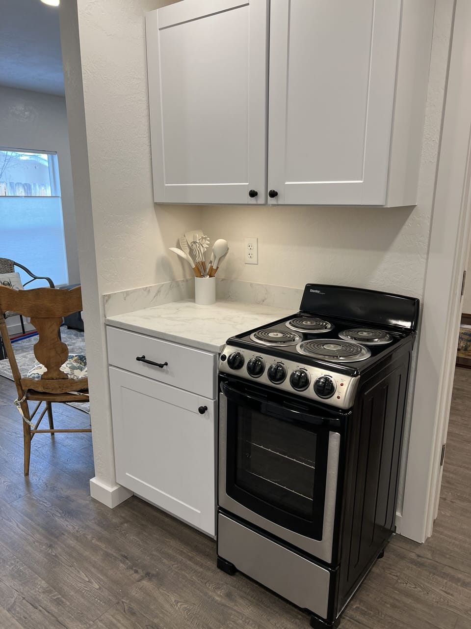 Kitchen with apartment size range.