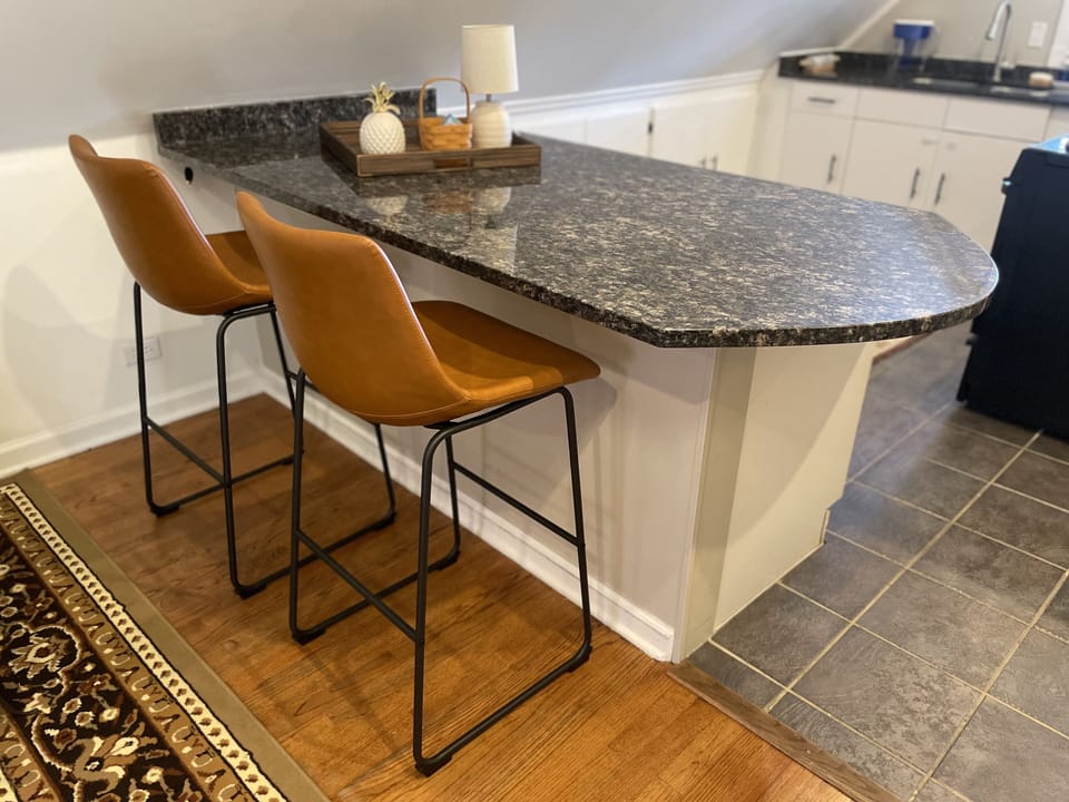 Kitchen counter with high barstools