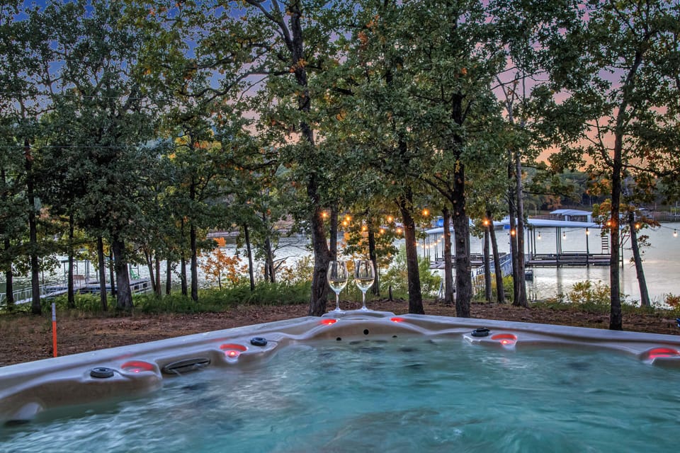 Hot tub view of the sunset over the lake and dock. 