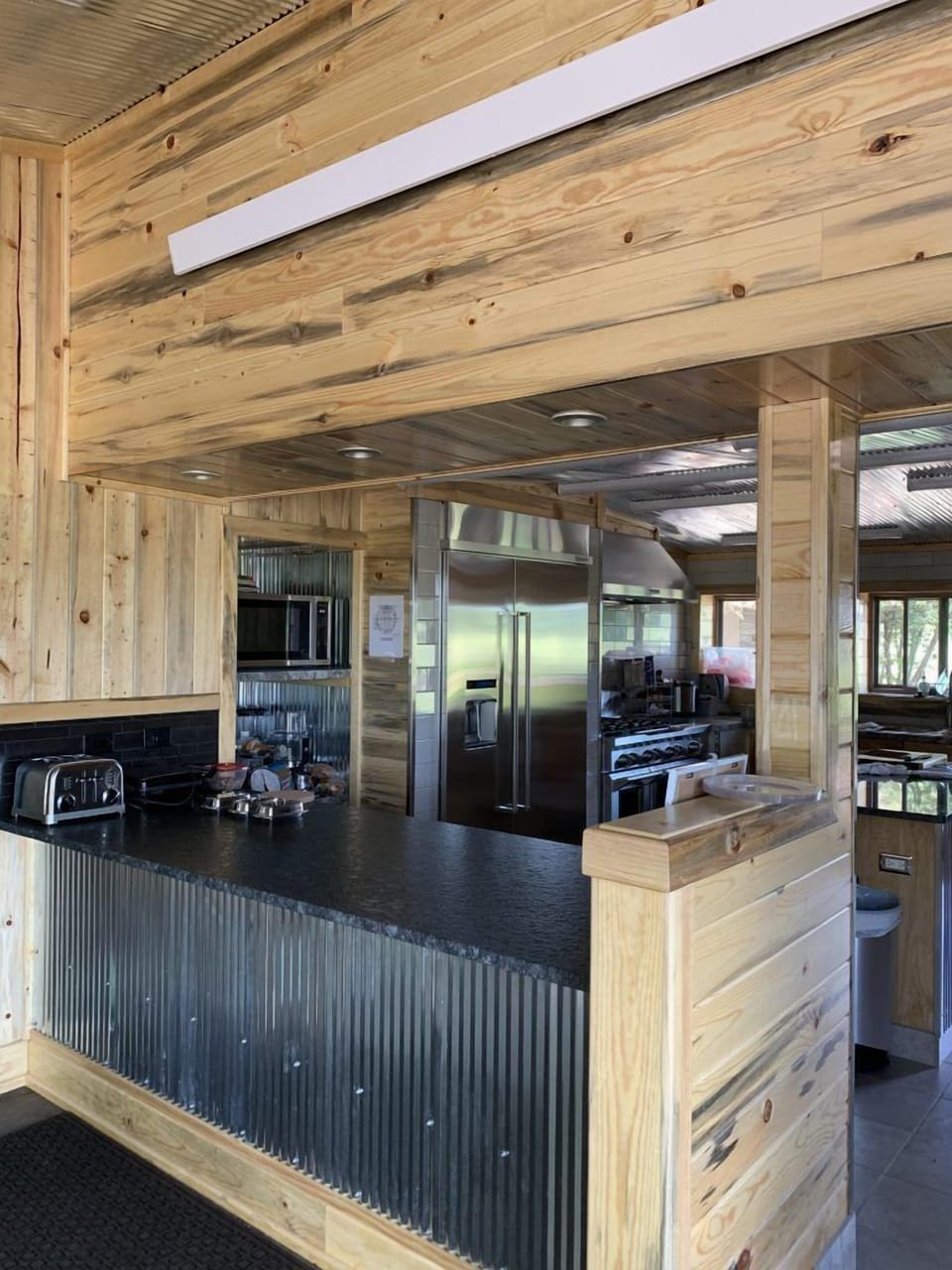 Oversize fridge and double oven for entertaining convenience.