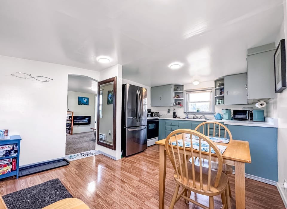 Full - eat-in kitchen. Table settings for 2-4 people. 